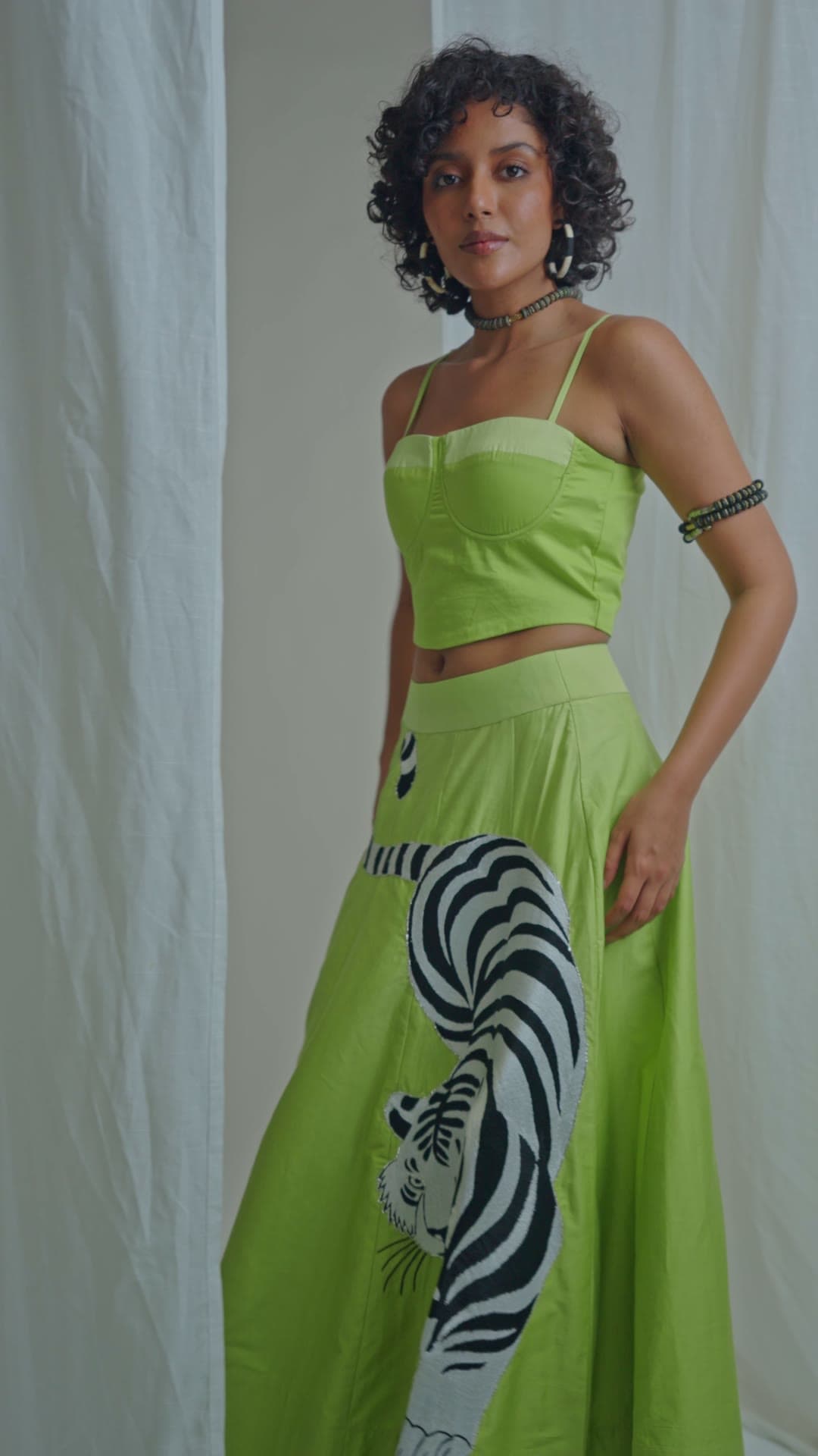 A customer wearing a piece from the collection
